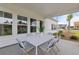 Covered patio with outdoor dining furniture, perfect for relaxing and entertaining at 116 Snow St, Summerville, SC 29486