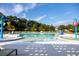 The neighborhood pool offers multiple chairs with yellow umbrellas for comfortable sunbathing, plus fun, colorful water features at 116 Snow St, Summerville, SC 29486