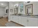 Elegant bathroom with double vanity, ample countertop space, and well-lit mirrors, offering a functional and stylish design at 1184 Reserve Ln, Awendaw, SC 29429