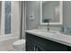 Stylish bathroom featuring blue tile accents, a quartz countertop, and modern fixtures at 1184 Reserve Ln, Awendaw, SC 29429