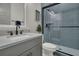 Modern bathroom featuring a gray vanity, glass shower, and contemporary fixtures at 1184 Reserve Ln, Awendaw, SC 29429