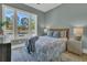 Comfortable bedroom featuring large window, area rug, and dresser at 1184 Reserve Ln, Awendaw, SC 29429