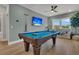 Recreational game room featuring a pool table, comfortable sofa, and a bright window view at 1184 Reserve Ln, Awendaw, SC 29429