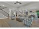 Open-concept living room with contemporary furnishings, hardwood floors, and seamless flow to the kitchen, ideal for entertaining at 1184 Reserve Ln, Awendaw, SC 29429