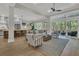 Spacious living room with large windows, a comfortable seating area, and an inviting atmosphere, perfect for relaxation and gatherings at 1184 Reserve Ln, Awendaw, SC 29429
