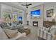 Cozy living room featuring a fireplace, comfortable seating, and natural light, creating a warm and inviting space for relaxation at 1184 Reserve Ln, Awendaw, SC 29429
