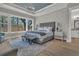 Comfortable main bedroom with bright lighting, large windows, and a luxurious bed creating a cozy retreat at 1184 Reserve Ln, Awendaw, SC 29429