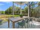 Covered outdoor patio area, dining table set for six, and overlooks large green lawn at 1184 Reserve Ln, Awendaw, SC 29429