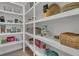 Walk-in pantry features custom shelving and plenty of space for food storage at 1184 Reserve Ln, Awendaw, SC 29429