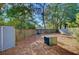 Wood fenced backyard with shed and wooded area at 1203 Meadow Park Ln # B, Mount Pleasant, SC 29464