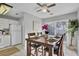 Dining room with decorative painting, ceiling fan and view into kitchen at 1203 Meadow Park Ln # B, Mount Pleasant, SC 29464