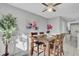 Dining room with decorative painting, ceiling fan and view into other spaces at 1203 Meadow Park Ln # B, Mount Pleasant, SC 29464