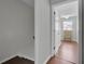 Hallway view to bedroom with wood floors, a light gray wall and a window at 1203 Meadow Park Ln # B, Mount Pleasant, SC 29464
