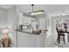 Charming kitchen with ample counter space, white cabinetry, and seamless dining area access at 1203 Meadow Park Ln # B, Mount Pleasant, SC 29464