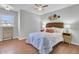 Bedroom with a ceiling fan, hardwood floors, and stylish decor at 1203 Meadow Park Ln # B, Mount Pleasant, SC 29464