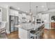 Bright, modern kitchen with white cabinets, a marble countertop, and a large island at 139 Calm Water Way, Summerville, SC 29486