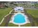 Aerial view of the community pool, and clubhouse featuring many lounge chairs and manicured landscaping at 139 Calm Water Way, Summerville, SC 29486