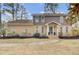 Charming two-story brick and siding home with landscaped front yard and welcoming entrance at 1541 Hutton Pl, Charleston, SC 29407