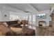 Cozy living room with a comfortable sectional sofa, wood floors, and french doors leading to an adjacent room at 1541 Hutton Pl, Charleston, SC 29407