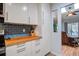 Bright kitchen featuring stainless steel appliances and breakfast nook with sunroom view at 1570 Brianna Ln, Charleston, SC 29412