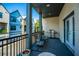 Charming balcony with gray decking, comfortable seating, and a grill at 1641 Florentia St, Mount Pleasant, SC 29464