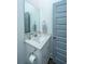Powder room with modern vanity, white marble countertop, and gray accent door at 1641 Florentia St, Mount Pleasant, SC 29464