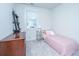 Well-lit bedroom with a single bed, bedside table, and natural light from a window at 1641 Florentia St, Mount Pleasant, SC 29464