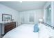 Spacious bedroom with three windows, dresser, and sleek black metal bedframe at 1641 Florentia St, Mount Pleasant, SC 29464