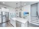 Well-equipped kitchen with stainless steel appliances, ample counter space, and a view of the staircase at 1641 Florentia St, Mount Pleasant, SC 29464
