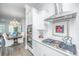 Gourmet kitchen featuring stainless steel appliances, granite countertops, and seamless transition to the dining area at 1641 Florentia St, Mount Pleasant, SC 29464