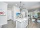 Bright, open kitchen featuring a spacious island, stainless steel appliances, and stylish pendant lighting at 1641 Florentia St, Mount Pleasant, SC 29464