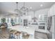 Spacious open kitchen with large island, stainless steel appliances, and seamless flow to dining and living areas at 1641 Florentia St, Mount Pleasant, SC 29464