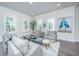 Inviting living room with large windows, stylish furniture, and elegant accents at 1641 Florentia St, Mount Pleasant, SC 29464