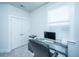 Bright office space with glass top desk and view of closet storage space at 1641 Florentia St, Mount Pleasant, SC 29464