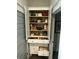 A well-organized pantry features adjustable shelves, drawers, and ample storage for kitchen essentials at 1641 Florentia St, Mount Pleasant, SC 29464