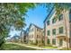 Attractive street showcasing a row of modern brick townhomes with manicured lawns and walkways at 1641 Florentia St, Mount Pleasant, SC 29464