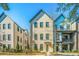 Charming three-story home boasting a light brick facade and meticulously kept landscaping at 1641 Florentia St, Mount Pleasant, SC 29464