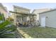 Charming backyard with a pergola, outdoor dining set and covered porch at 1738 Towne St, Johns Island, SC 29455