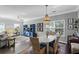 Cozy dining area with bead chandelier and colorful rug, open to living space at 1738 Towne St, Johns Island, SC 29455