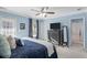 Comfortable main bedroom featuring a ceiling fan, ensuite bathroom, and closet space at 1738 Towne St, Johns Island, SC 29455