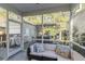 Relaxing screened-in patio features an outdoor sofa set and open views of the backyard at 1738 Towne St, Johns Island, SC 29455