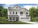 Stunning two-story white home featuring a balcony, a two-car garage and lush green landscaping at 203 Pine Crest View Dr, Summerville, SC 29486