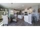 Charming kitchen with stainless steel appliances, ample cabinet space, a central island, and a dining table at 203 Pine Crest View Dr, Summerville, SC 29486
