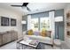 Comfortable living room with stylish seating, modern decor, and natural light streaming through large windows at 203 Pine Crest View Dr, Summerville, SC 29486