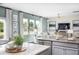 Bright and airy living room with large windows, comfortable seating, and modern decor for relaxed living at 203 Pine Crest View Dr, Summerville, SC 29486