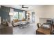 Inviting living area with plush sofa, contemporary decor, and ample natural light, creating a cozy retreat at 203 Pine Crest View Dr, Summerville, SC 29486