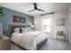 Comfortable bedroom with a large bed, stylish wall decor, a window with curtains, and soft carpeting at 203 Pine Crest View Dr, Summerville, SC 29486