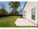 Spacious backyard with a concrete patio, green grass, privacy fence and mature trees at 204 Candleberry Cir, Goose Creek, SC 29445