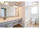 Bright bathroom featuring a vanity with a large mirror, tile floors and a tub with shower at 204 Candleberry Cir, Goose Creek, SC 29445