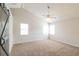 Bright bedroom with neutral carpeting, a modern ceiling fan, and large windows at 204 Candleberry Cir, Goose Creek, SC 29445